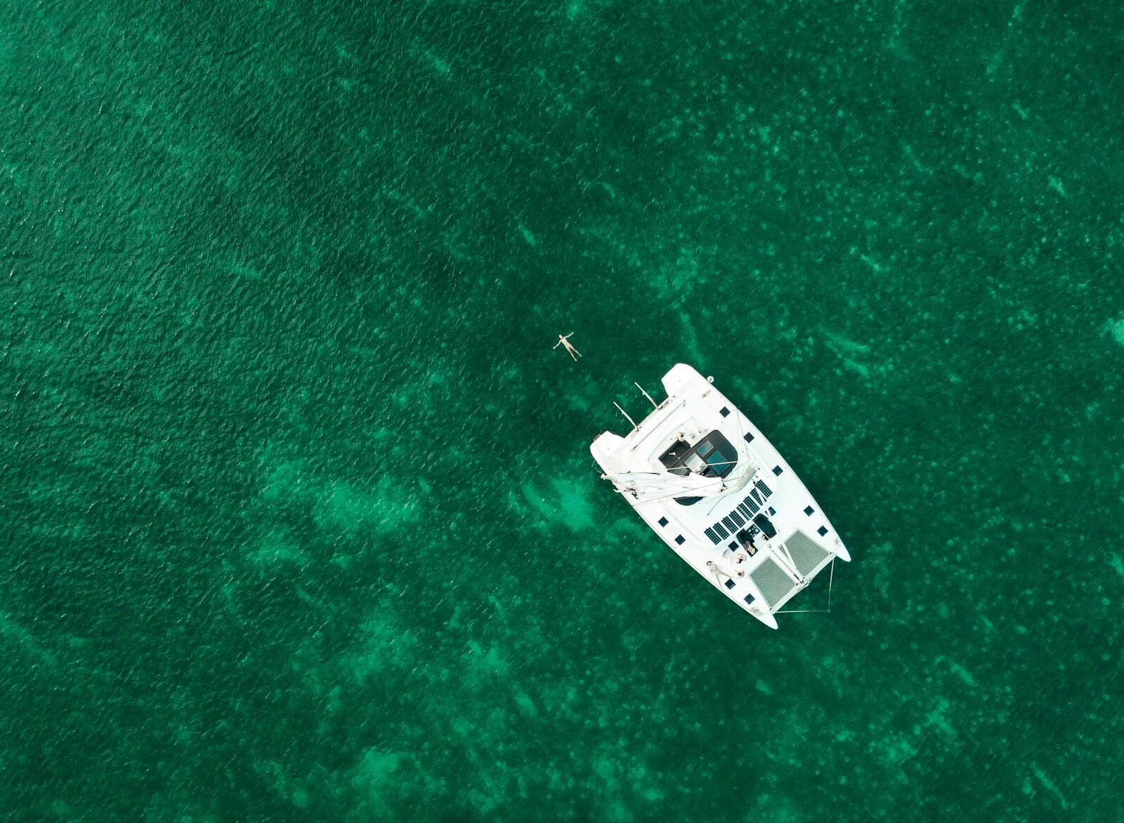 Tender at anchor, turquoise soundings